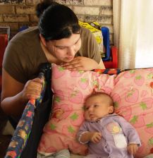Adrianna earned a portable playpen/crib from NPRA by seeking pre-natal care and parenting classes.