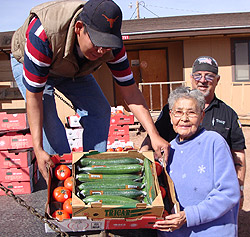 Native American Elder receiving fresh produce.