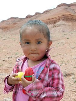 Native American child enjoying Easter eggs.