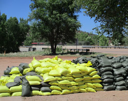 sandbags being stacked up to protect against flooding